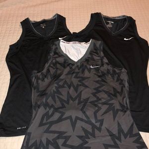 Three Nike Dri-Fit tanks